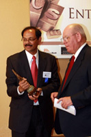 Venkat Reddy, dean, College of Business, presents the Lifetime Entrepreneurship Award to Gary Loo